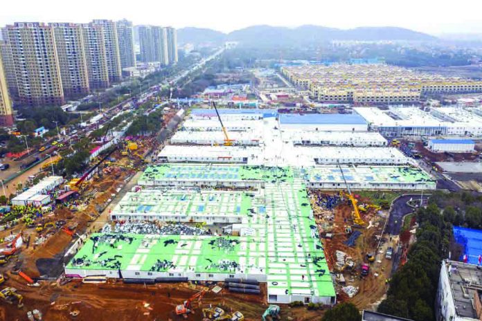 The Huoshenshan temporary field hospital under construction is seen as it nears completion in Wuhan in central China's Hubei Province, Sunday, Feb. 2, 2020. CHINATOPIX VIA AP