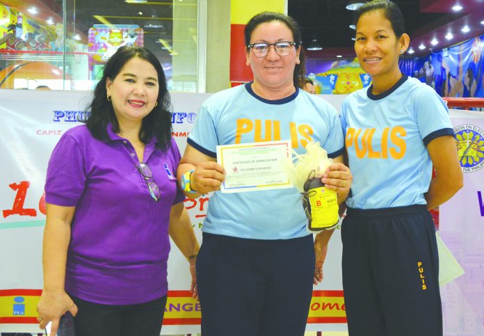 Philippine Information Agency VI Officer in Charge Jemin Guillermo (left)