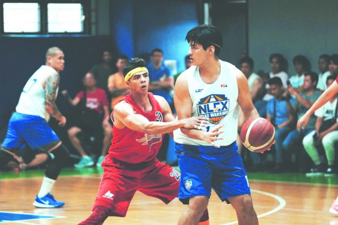 NLEX Road Warriors’ Kris Porter measures the defense of San Miguel Beermen’s Arwind Santos. NLEX PHOTO