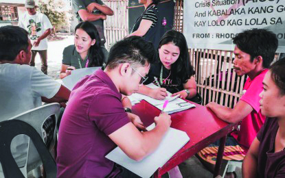 Personnel of the Antique Provincial Social Welfare and Development Office conduct an interview with the boatmen of Mararison Island in order for the to qualify from the financial aid provided by the government. PSWDO ANTIQUE