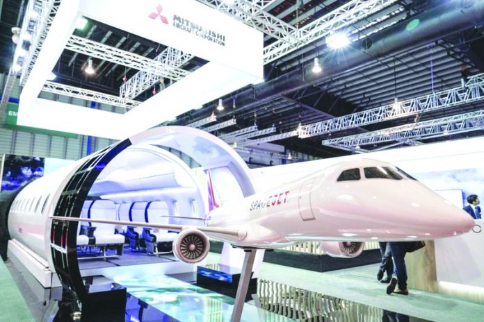 A static model of a Mitsubishi Aircraft Spacejet sits on display at the Singapore Airshow on Tuesday, Feb. 11, 2020, in Singapore. AP