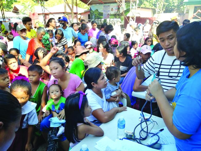 Mothers, children and senior citizens avail free dental, medical and other services provided by the government during the Serbisyo Caravan in Barangay Montilla, Moises Padilla, Negros Occidental on Feb. 18. The delivery assistance was in line with the implementation of the Retooled Community Support Program