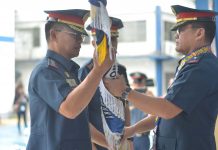 CHANGE OF COMMAND. Police Colonel Eric Dampal (left) formally takes over as director of the Iloilo City Police Office during a change of command presided by Police Brigadier General Rene Pamuspusan (right), Western Visayas police director, on Feb. 20, 2020. Looking on (partly hidden) is Dampal’s predecessor, Police Colonel Martin Defensor, now the chief of the Directorial Staff, Police Regional Office 6. IAN PAUL CORDERO/PN