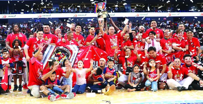 San Miguel Corporation sports director Alfrancis Chua (raising both arms) celebrates the championship of the Barangay Ginebra Kings durin the 2019 Philippine Basketball Association Governors’ Cup Finals. PBA