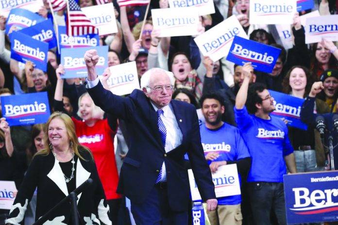 Democratic presidential candidate Sen. Bernie Sanders, I-Vt., with his wife Jane O'Meara Sanders, arrives to speak to supporters at a primary night election rally in Manchester, N.H., Tuesday, Feb. 11, 2020. AP