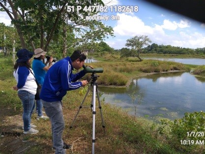 The staff of CENRO Guimbal used binoculars and spotting scope as they count waterbirds flocking in a wetland at Hinactacan, La Paz, Iloilo City. 