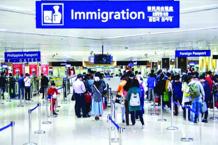 Passengers arriving at the Ninoy Aquino International Airport Terminal 1 in Parañaque City wear face masks as a precaution. President Rodrigo Duterte has expanded the ban on travelers to and from mainland China, Hong Kong, and Macau. ABS-CBN NEWS