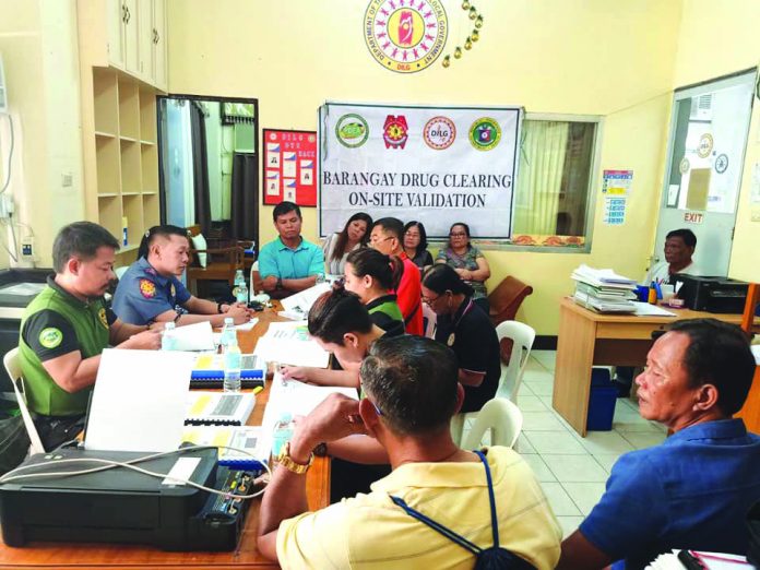 Village officials from five barangays in Kalibo, Aklan attend the checking of the documents of their respective villages by the Philippine Drug Enforcement Agency-Aklan at the DILG office of the province on Feb. 26. Their villages were cleared of illegal drugs on Feb. 27. PDEA REGION 6