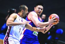 Beau Belga defends the ball from being stolen by a Qatari defender during his international stint with Gilas Pilipinas. GILAS PILIPINAS TWITTER