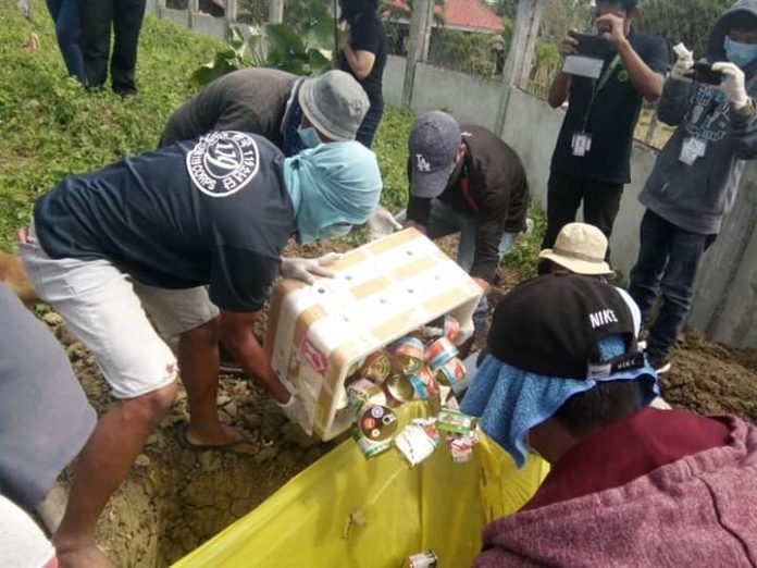 Confiscated meat and meat products are being disposed at the dumpsite in Cabatuan, Iloilo by quarantine personnel of the Bureau of Animal Industry. The items were intercepted at the Iloilo Airport. Most of these were from Singapore, Hong Kong and the island of Luzon – areas with confirmed cases of African swine fever. PHOTO BY JINGLE CANTERO, LIVESTOCK INSPECTOR II, PVO