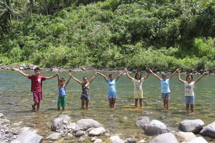 Youths from Madalag, Aklan poses after their small group discussion about International Day of Forest in one of the protected area of DENR, the Aklan River Watershed Forest Reserve./PENRO Aklan