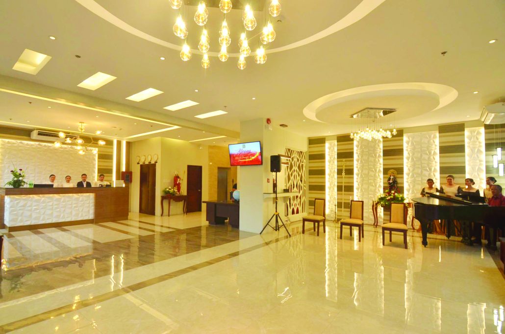 The hotel lobby gives off a homey ambiance with its soft lights and hues