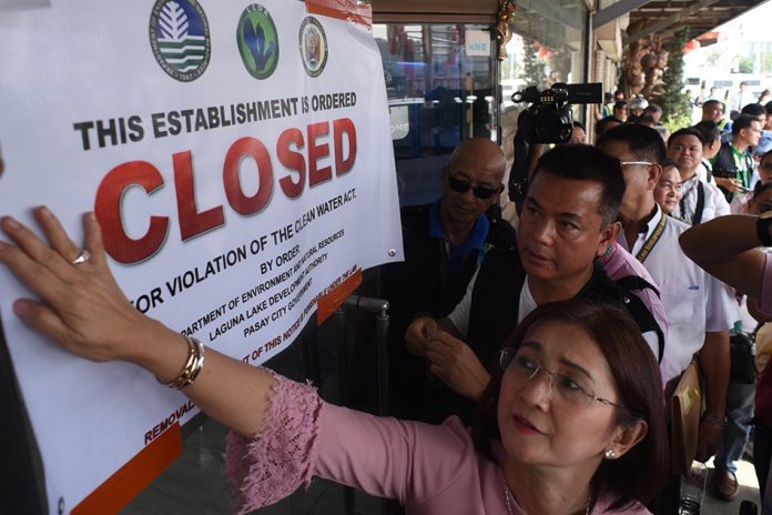 The Philippine government closes down five business establishments in Pasay City after they were found discharging untreated wastewater into Manila Bay. ABS-CBN