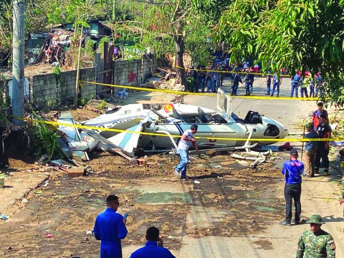 The site of the helicopter crash in San Pedro, Laguna, south of Manila on Thursday. AARON FAVILA/AP