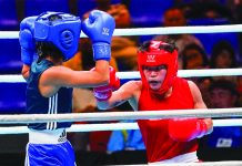 Ilongga amateur boxer Irish Magno (red) books a ticket to the 2020 Tokyo Olympics after defeating Tajikistan's Sumaiya Qosimova via unanimous decision in the 2020 Asia and Oceania Olympic Boxing Qualifying Tournament in Amman, Jordan yesterday afternoon. ABS-CBN NEWS