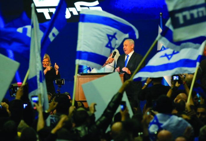 While there is no guarantee that Israeli Prime Minister Benjamin Netanyahu can form a coalition, he hailed the election as a 'giant' success. AFP