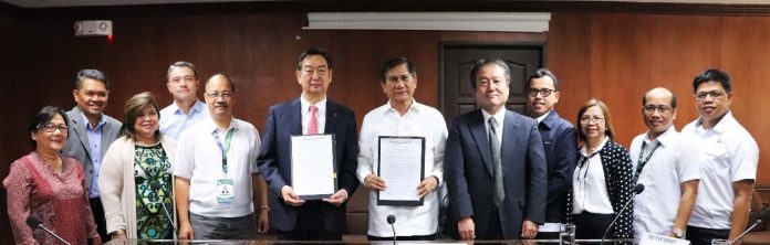 From center left: MMPC president and CEO, Mutsuhiro Oshikiri; DENR secretary Roy Cimatu; MMPC senior vice president for Corporate Division, Yasuki Maruyama and other key officers of DENR and MMPC during the MOA Signing at the DENR Central Office.