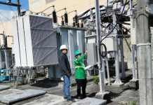 POWER IN THEIR HANDS. Personnel of MORE Electric and Power Corp. check the power substation on General Luna Street, Iloilo City after taking over the facility from Panay Electric Co.