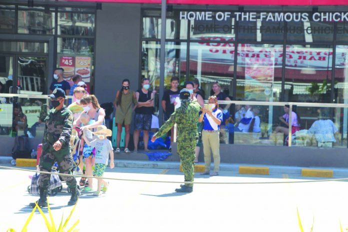 Personnel of the Malay municipal police station assist in transporting stranded Russian tourists going to the Cagban Jetty Port in Boracay Island, Malay, Aklan on March 30. The Russians will be brought to the Kalibo International Airport and will eventually be sent back to their country with the help of the Russian Embassy. MALAY PS MASALIGAN