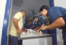 Police officers under the Iloilo City Police Office submit urine samples for drug testing on March 9, 2020. Those who will test positive for illegal drugs face administrative charges and could be removed from the service. IAN PAUL CORDERO/PN