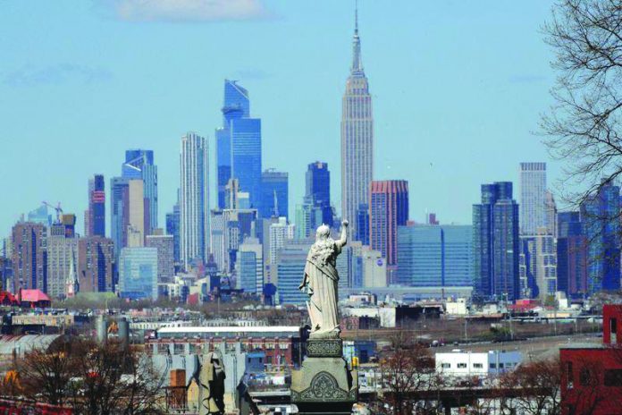 A view of the Manhattan skyline as seen from the Linden Hill Cemetery during the outbreak of the coronavirus disease in the Brooklyn borough of New York City, New York, United States on April 6, 2020. REUTERS