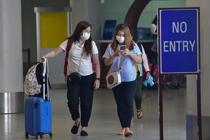 Scenes at the Ninoy Aquino International Airport Terminal 3 on Mar. 13, 2020, two days before the imposition of a travel ban to and from Metro Manila as part of the declared community quarantine of the country’s capital. ABS-CBN