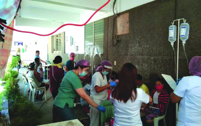 Health personnel of the Alfredo E. Marañon Sr. Memorial District Hospital in Sagay City, Negros Occidental attend patients who fell ill after eating linugaw, which contained intoxicating yam on April 10. As of yesterday, the residents were cleared from hospitalization. SAGAY CDRRMO