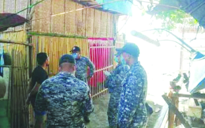 Personnel of the Philippine Coast Guard check the newly-arrived persons in a shoreline village in Manapla, Negros Occidental on April 20 as part of their maritime border control measures. Two persons have been confirmed to have sneaked in this province amid the enhanced community quarantine against coronavirus disease 2019. PCG-NEGROS OCCIDENTAL