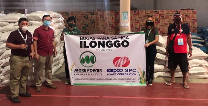 The Iloilo City government represented by Executive Assistant Francis Cruz (second from left) accepts from MORE Electric and Power Corp. president Roel Z. Castro (extreme left) a donation of 30 sacks of rice. MORE Power previously donated facemasks, alcohol, sanitizers, and food packs to frontliners in Iloilo City battling the spread of the coronavirus disease 2019.