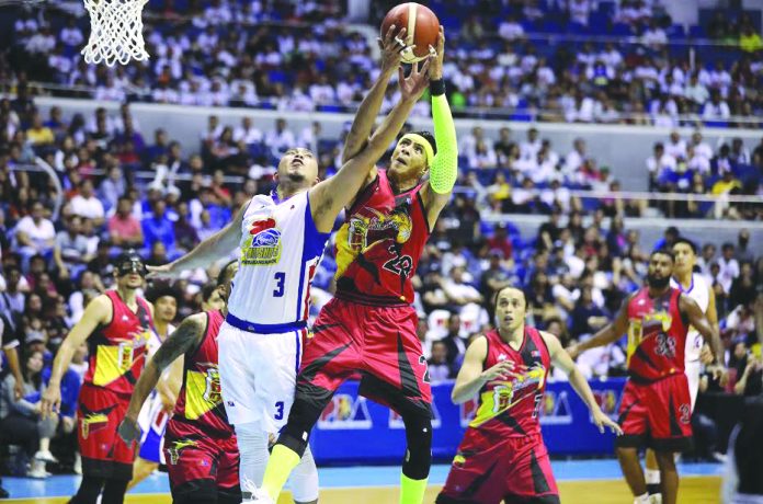 San Miguel Beermen’s Arwind Santos and Magnolia Hotshot’s Paul Lee battle for the board during Philippine Basketball Association (PBA) Philippine Cup’s only match this season before it was halted due to the enhanced community quarantine in Luzon. PBA officially reduced its Season 45, but its board has yet to determine a new format. PBA