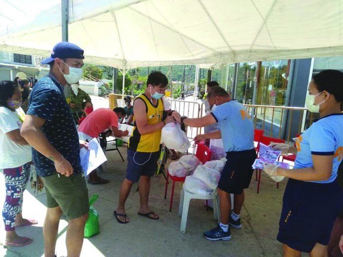 Stranded Capizeños in the world-famous Boracay Island in Malay, Aklan receive food packs from their provincial government on April 19. According to the Public Employment Service Office in Malay, there are 344 workers in Boracay who are still stranded due to the enhanced community quarantine imposed to fight the spread of coronavirus disease 2019. MALAY PS MASALIGAN