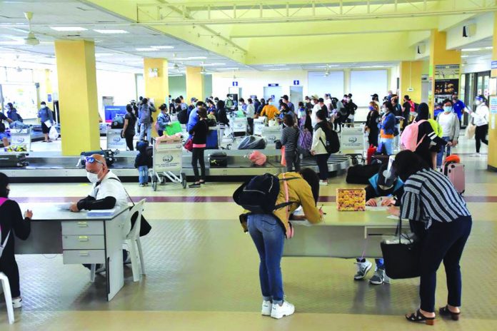 Locally stranded individuals (LSIs) return home to Negros Occidental from Metro Manila via a sweeper flight that landed at the Bacolod-Silay Airport in Silay City last week. Twelve more residents of the province – all either LSIs or overseas Filipino workers – tested positive for coronavirus disease 2019. PROVINCIAL GOVERNMENT OF NEGROS OCCIDENTAL