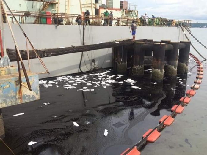 BARGE BLAST AND OIL SPILL. An explosion at a power barge in the waters off Barangay Bo. Obrero in Lapuz, Iloilo City yesterday afternoon (July 3, 2020) resulted to an oil spill that the Philippine Coast Guard rushed to contain with the help of the Bureau of Fire Protection. Initial estimate of the volume of bunker fuel that spilled into the water was around 48,000 liters covering an area of some 1,200 square meters. IAN PAUL CORDERO/PN