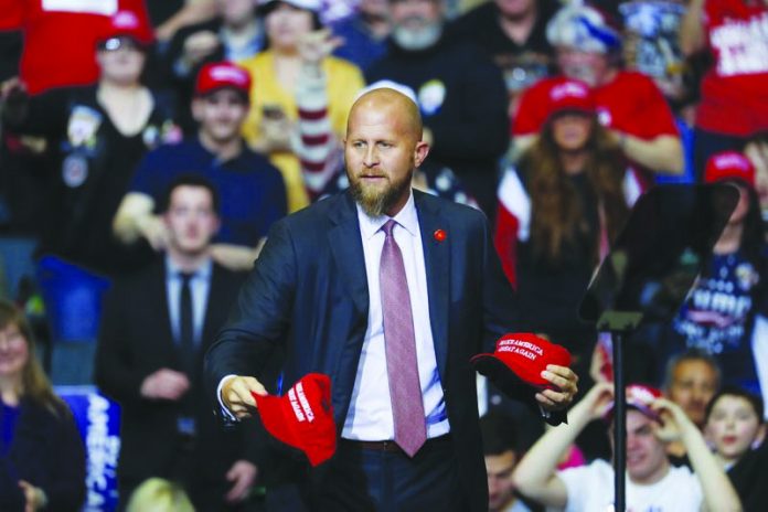 Brad Parscale, manager of President Donald Trump's reelection campaign, throws "Make America Great Again," hats to the audience before a rally in Grand Rapids, Michigan, United States. AP