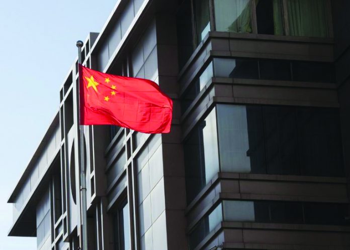 China’s national flag is seen waving at the China Consulate General in Houston, Texas. FILE PHOTO/REUTERS