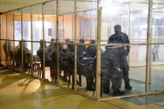 Guimaras policemen wait for their turn to be tested. The provincial government of Guimaras has expanded its targeted testing in a bid to stop the spread of the coronavirus disease. PHOTO COURTESY OF THE GUIMARAS CAPITOL