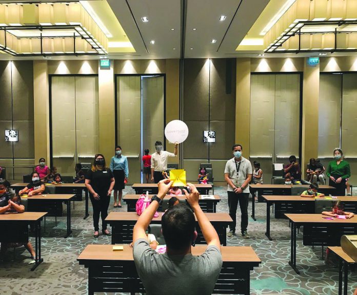 Treating the kids to an afternoon of fun through origami and learning proper hand washing with the associates of Courtyard by Marriott Iloilo in partnership with AC Energy Philippines Inc.