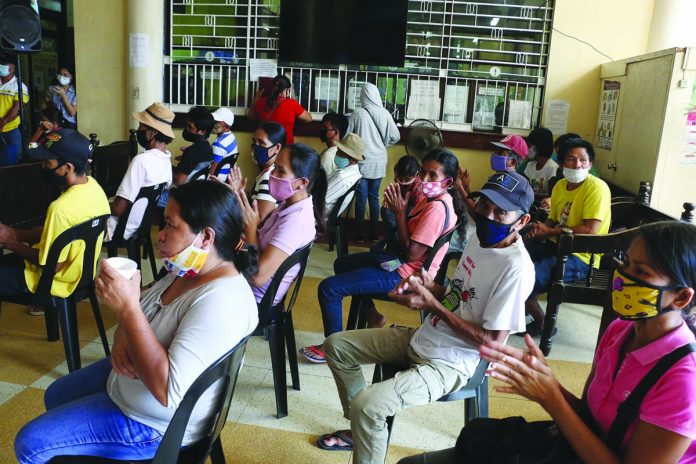 Sugar migrants from southern towns in Antique wait to avail themselves of the livelihood assistance from the provincial government on July 19. The assistance primarily aims to help the sugar migrants find alternative livelihood in this province so they would no longer return working in Negros Occidental. PROVINCE OF ANTIQUE