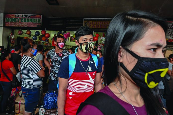 The World Health Organization says that only non-medical fabric masks can be reused but these should be washed with water and detergent. RAPPLER