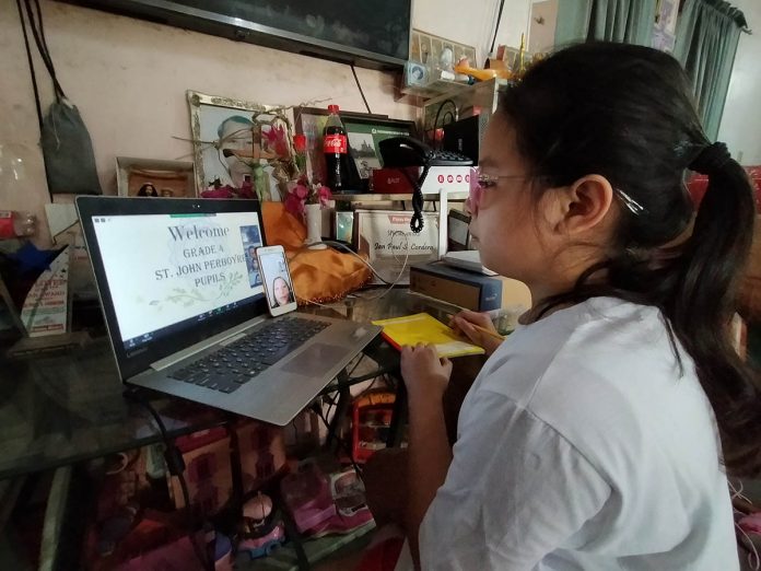 A student enrolled in a private school in Iloilo City participates in an online homeroom orientation on Friday. The opening of classes in public schools was moved to Oct. 5. However, private schools that have already started classes may be allowed to proceed. IAN PAUL CORDERO/PN