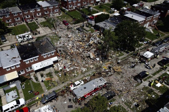 Debris and rubble covers the ground in the aftermath of an explosion in Baltimore on Monday, Aug. 10, 2020. AP