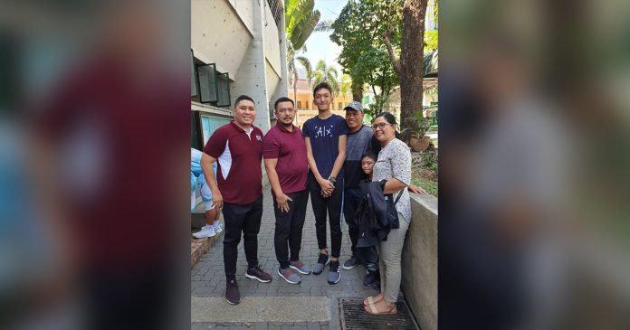 Heinz Gabriel Demisana was flanked by his relatives, UPIS team manager Dale Villajuan and UP Fighting Maroons head coach Dolreich Perasol. CONTRIBUTED PHOTO