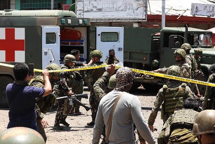 Military personnel carry on stretchers some of the victims after an improvised bomb exploded next to a military vehicle in Jolo, Sulu on Monday, August 24, 2020. At least 15 were killed and dozens wounded after the twin explosions. NICKEE BUTLANGAN/ AFP