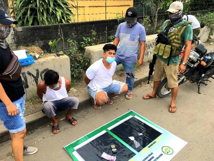 Antidrug personnel conduct an inventory of items seized from Joebern Hermosura and Fernando Tandoy, who were nabbed in an entrapment operation in Barangay Mansilingan, Bacolod City on Aug. 24. PDEA-6