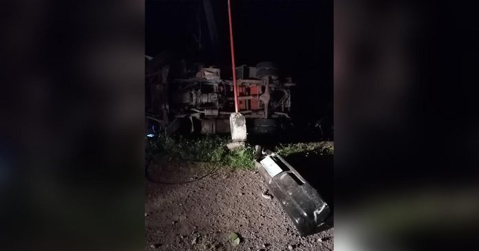 A delivery truck fell on its side in Barangay Malacañang, Culasi, Antique on Aug. 28. A minor passenger was killed and three others were injured. CULASI MPS