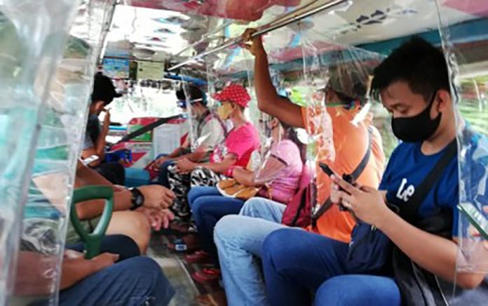 Passengers of a public utility jeepney comply with the mandatory wearing of face masks rule in Antique in this undated photo. The Department of the Interior and Local Government in the province said 12 local government units have submitted their ordinances on quarantine and health safety standard protocols before the Aug. 14 deadline. PNA