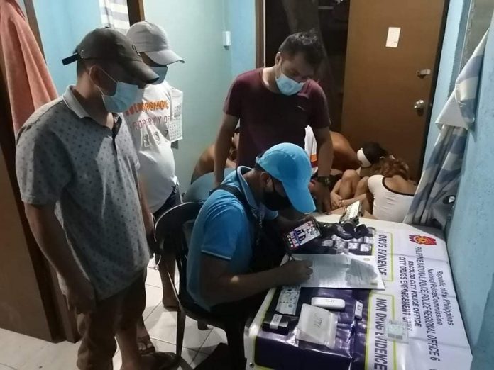 Antidrug personnel conduct an inventory of items seized in a buy-bust operation in Barangay Pahanocoy, Bacolod City on Aug. 27, which also led to the death of a high-value target and the arrest of seven other suspects. The operation yielded 55 grams of suspected shabu valued at around P374,000. BCPO VIA PNA