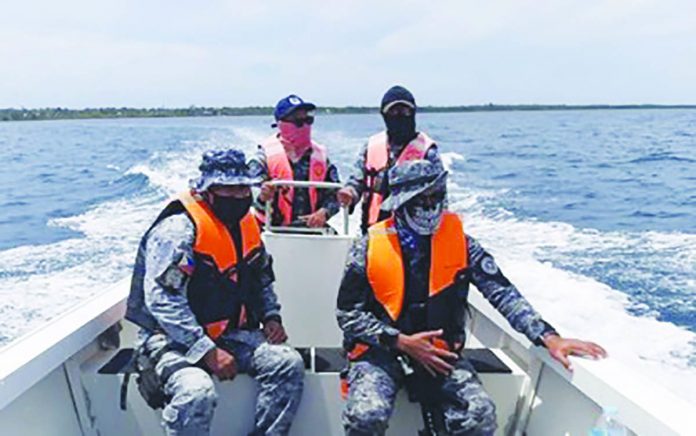 Personnel of the Philippine Coast Guard sub-station in San Carlos City, Negros Occidental patrol the coastal areas of the northern city in this undated photo. Operations have been intensified against the illegal entry of locally-stranded individuals from the neighboring Cebu province. SAN CARLOS CITY INFORMATION OFFICE VIA PNA