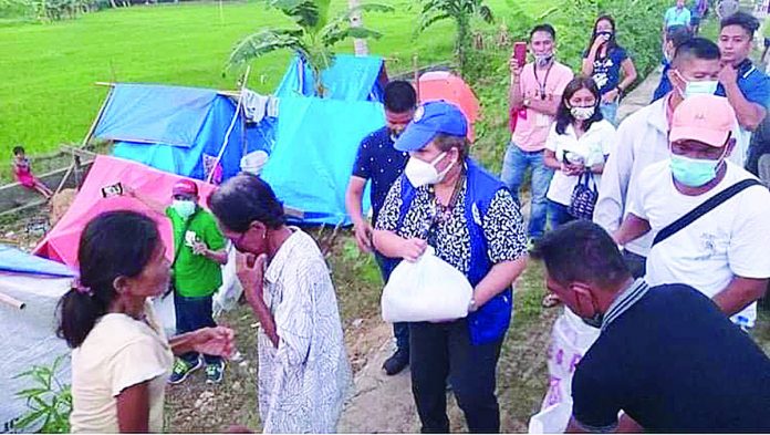 Philippine Charity Sweepstakes Office (PCSO) Board Director Sandra M. Cam is assisted by PCSO Masbate personnel and some local government units personnel in the distribution of relief packs to Masbate earthquake victims from the municipalities of Palanas, Cataingan, Esperanza, and Pio V. Corpuz. PCSO MASBATE