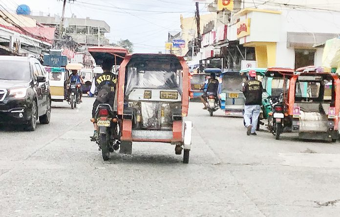 Tricycle drivers and operators in Kalibo, Aklan reeling from the effects of coronavirus pandemic are seeking for a tricycle fare increase. BOY RYAN ZABAL/AKEAN FORUM